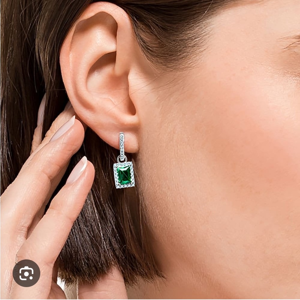 Swarovski rhodium plated silver and green drop earrings.